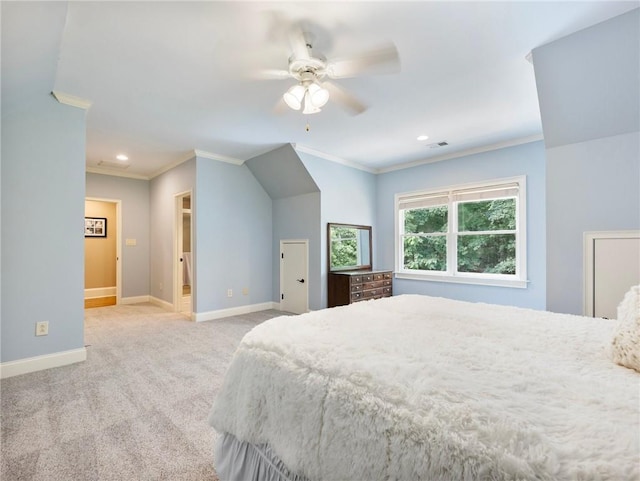 carpeted bedroom with ornamental molding and connected bathroom