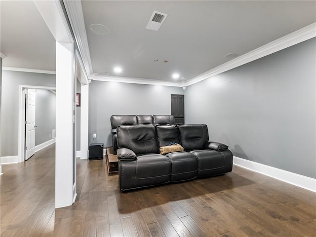 home theater with crown molding and dark hardwood / wood-style flooring