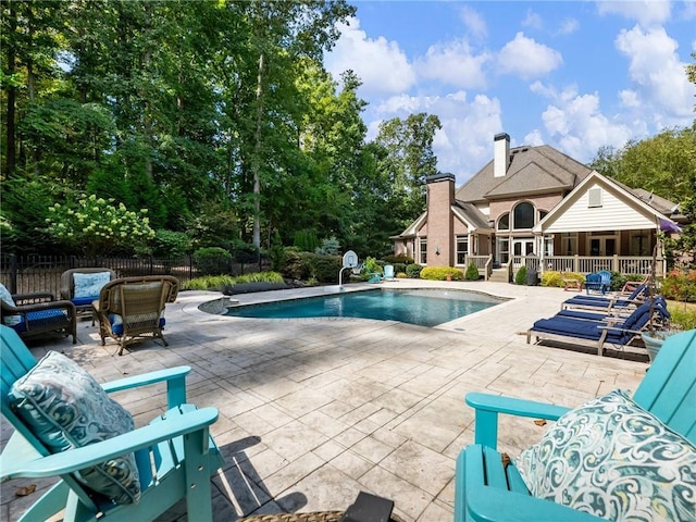 view of pool featuring a patio area