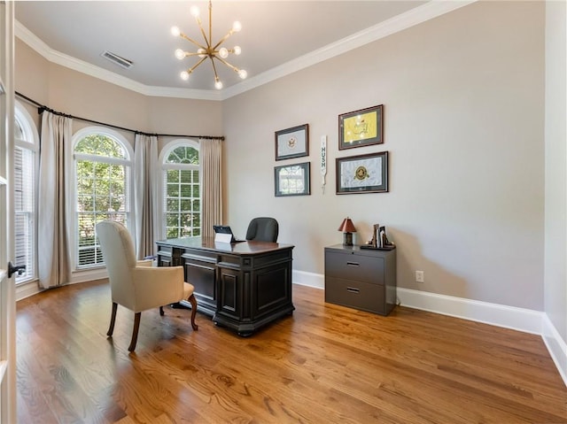 office featuring an inviting chandelier, crown molding, and light hardwood / wood-style floors