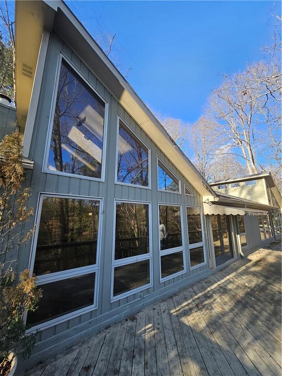 view of home's exterior with a wooden deck