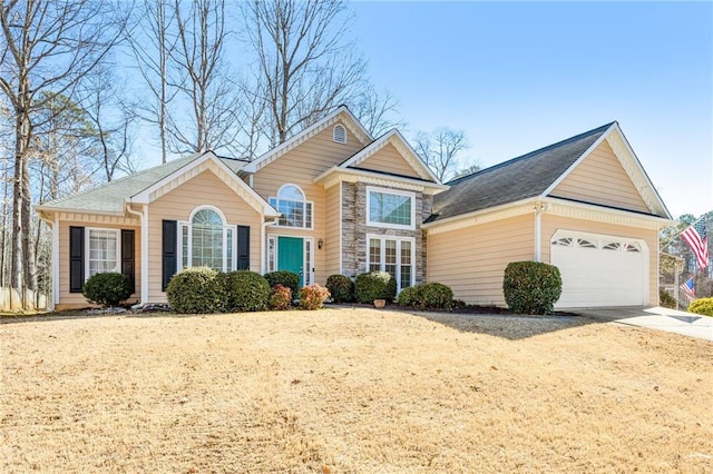 view of front of house with stone siding and concrete driveway