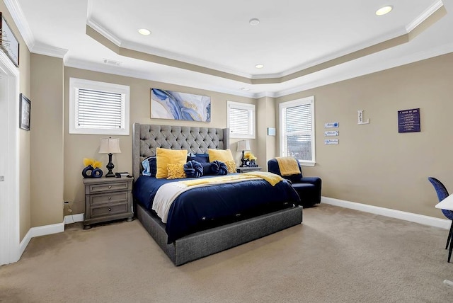 bedroom featuring a tray ceiling, light colored carpet, crown molding, and baseboards