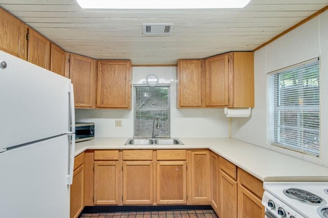 4937 Goddards Ford Rd, Gainesville, GA 30504 - kitchen with freestanding refrigerator, stainless steel microwave, light countertops, and wood ceiling