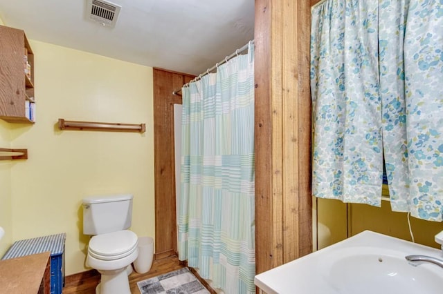 4937 Goddards Ford Rd, Gainesville, GA 30504 - full bath with vanity, wood finished floors, and a shower with shower curtain