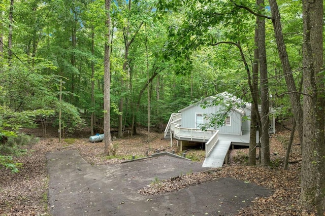 4937 Goddards Ford Rd, Gainesville, GA 30504 - view of yard with a forest view, a deck, and stairway