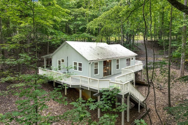 4937 Goddards Ford Rd, Gainesville, GA 30504 - back of house featuring a deck, a metal roof, a wooded view, and stairway