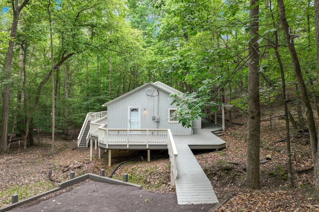 4937 Goddards Ford Rd, Gainesville, GA 30504 - back of property with a deck, a forest view, and stairs