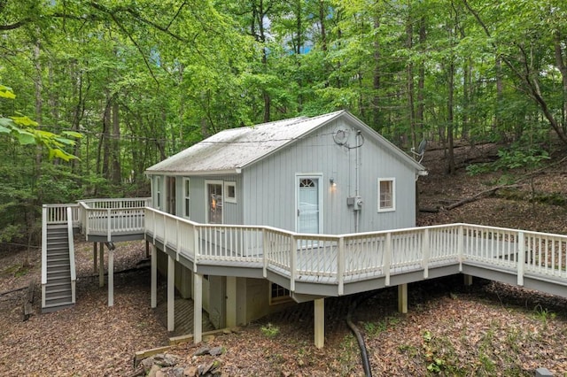 4937 Goddards Ford Rd, Gainesville, GA 30504 - back of property with a deck, stairs, and a wooded view