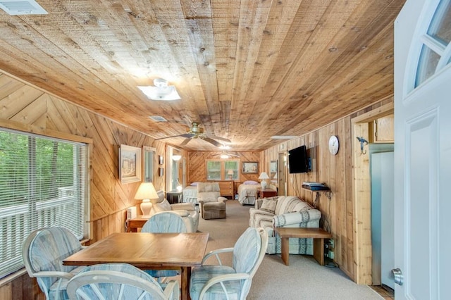 4937 Goddards Ford Rd, Gainesville, GA 30504 - carpeted dining room featuring wooden ceiling, wood walls, and a ceiling fan