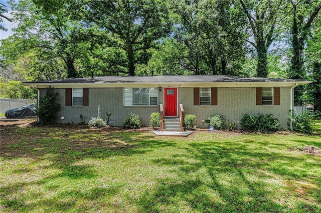 200 Robin Hood Ln, Hampton, GA 30228 - ranch-style house with entry steps, a front yard, brick siding, and crawl space