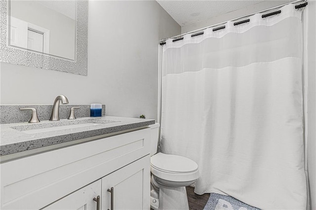 200 Robin Hood Ln, Hampton, GA 30228 - full bath with a textured ceiling, vanity, wood finished floors, and curtained shower