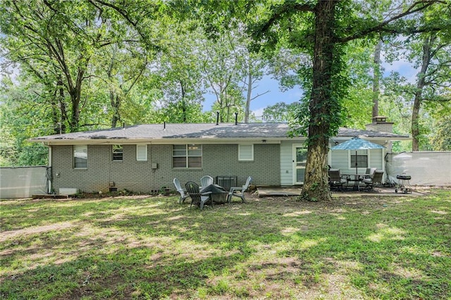 200 Robin Hood Ln, Hampton, GA 30228 - back of house with brick siding and a patio