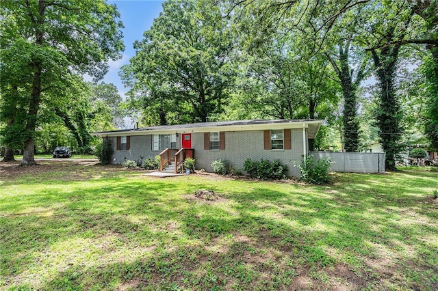 200 Robin Hood Ln, Hampton, GA 30228 - ranch-style home featuring brick siding and view of wooded area
