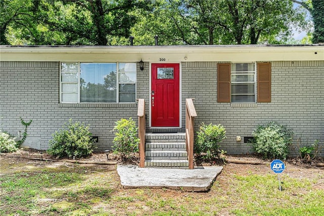 200 Robin Hood Ln, Hampton, GA 30228 - property entrance with brick siding and crawl space