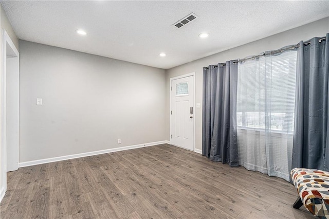 200 Robin Hood Ln, Hampton, GA 30228 - unfurnished room featuring wood finished floors and recessed lighting