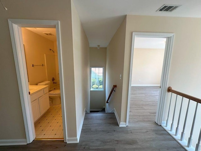 hallway with tile patterned floors