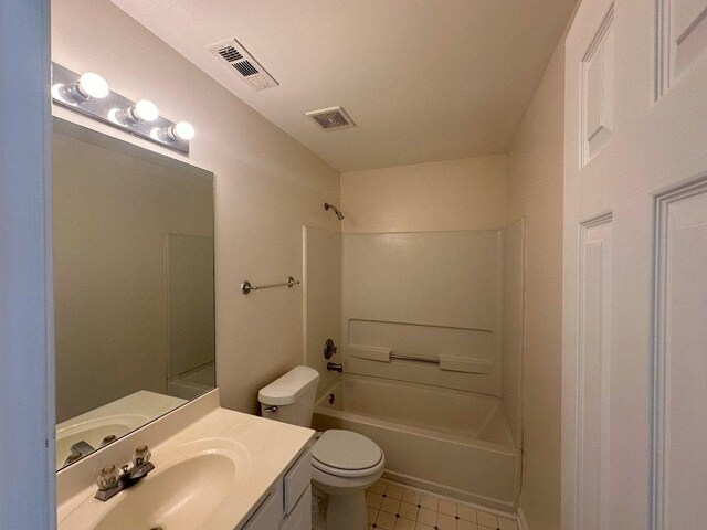 full bathroom featuring vanity, tub / shower combination, tile patterned flooring, and toilet