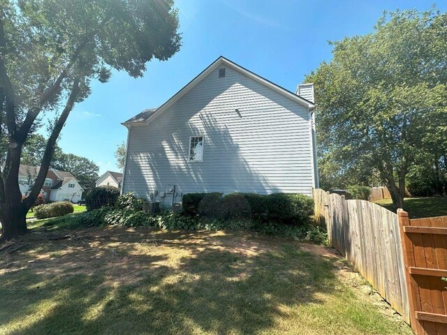 view of home's exterior featuring a lawn