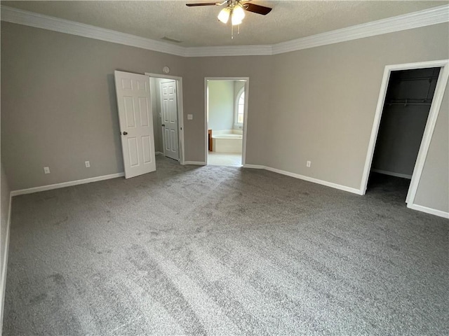 7123 Woodridge Ln, Union City, GA 30291 - unfurnished bedroom with ornamental molding, a spacious closet, carpet floors, ensuite bathroom, and a closet