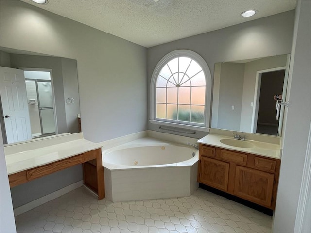 7123 Woodridge Ln, Union City, GA 30291 - full bath with a tub with jets, vanity, a stall shower, a textured ceiling, and tile patterned floors