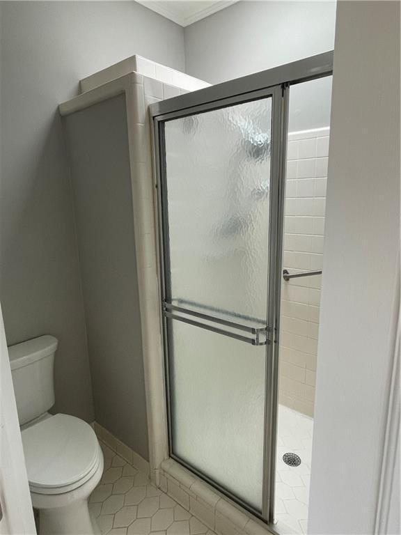 7123 Woodridge Ln, Union City, GA 30291 - bathroom with a shower stall and tile patterned flooring