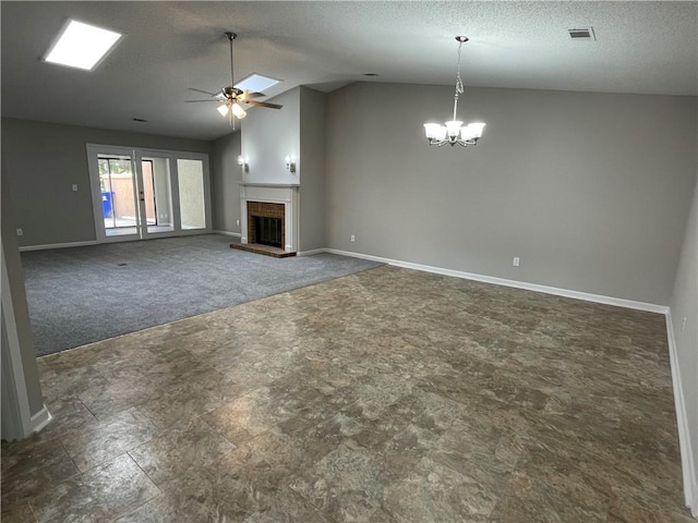7123 Woodridge Ln, Union City, GA 30291 - unfurnished living room with a ceiling fan, a chandelier, lofted ceiling, carpet floors, and a brick fireplace