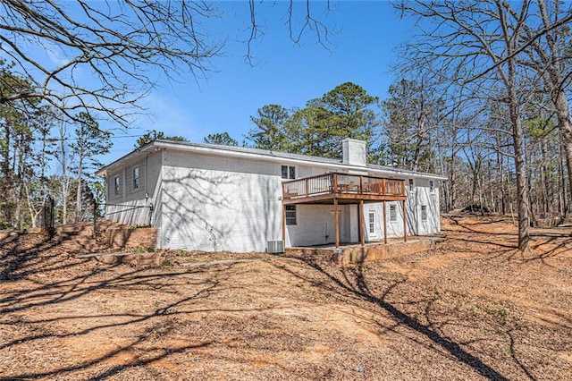 9640 Cedar Grove Rd, Fairburn, GA 30213 - view of property exterior featuring a deck, a chimney, and cooling unit