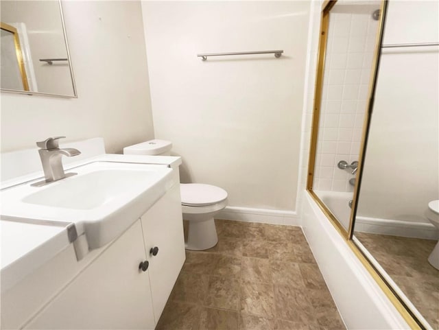 full bathroom with vanity, toilet, and bath / shower combo with glass door