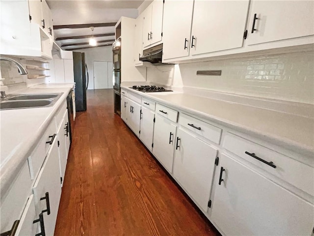 kitchen with white cabinetry, tasteful backsplash, sink, dark hardwood / wood-style floors, and beam ceiling