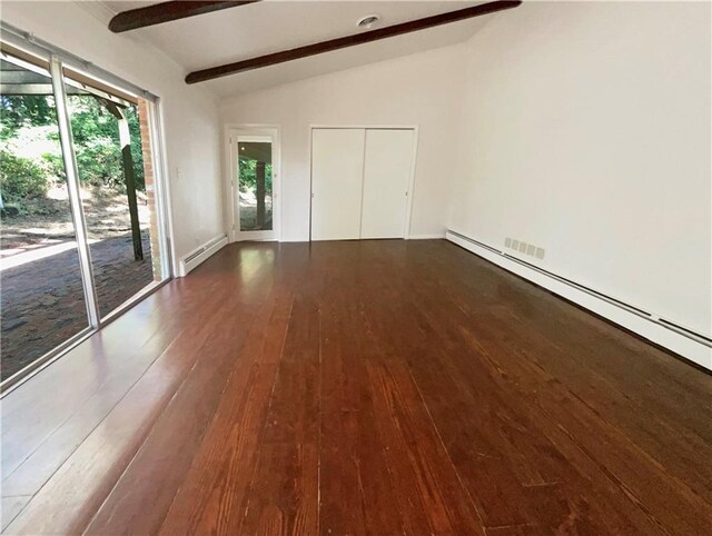 unfurnished bedroom with a baseboard heating unit, dark wood-type flooring, vaulted ceiling with beams, and access to outside