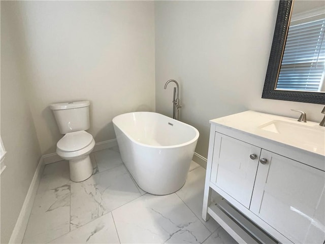 bathroom with a bath, toilet, and vanity