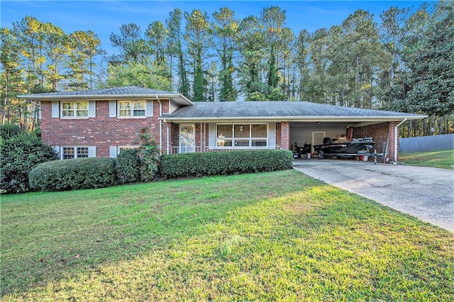 split level home featuring a carport and a front yard