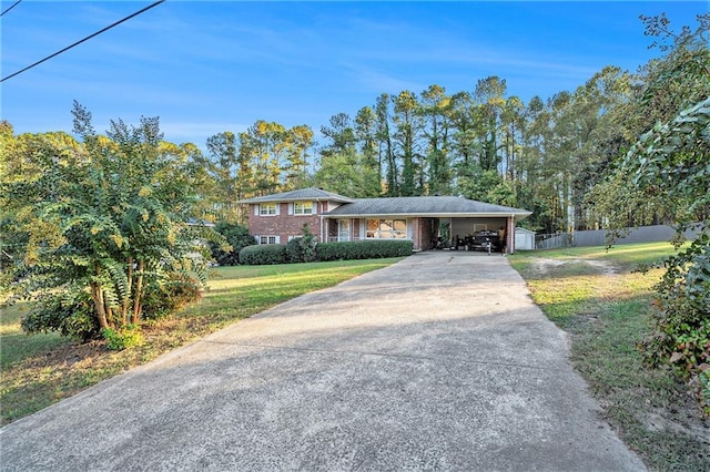 ranch-style home with a garage and a front yard