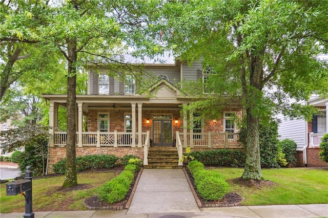 2112 Murren Dr SE, Smyrna, GA 30080 - view of front of home with a porch, french doors, stone siding, a front lawn, and stairs
