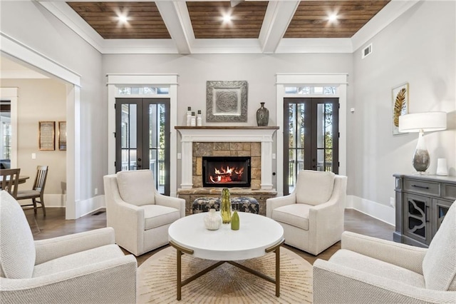 living room with a healthy amount of sunlight, french doors, and wooden ceiling