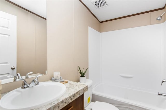 full bathroom featuring crown molding, shower / bathtub combination, vanity, and toilet