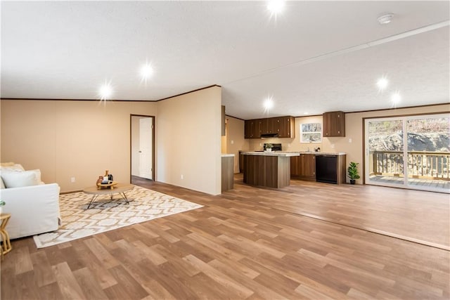 unfurnished living room with ornamental molding and light hardwood / wood-style floors