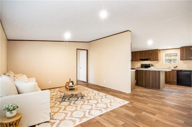 living room with crown molding and light hardwood / wood-style flooring