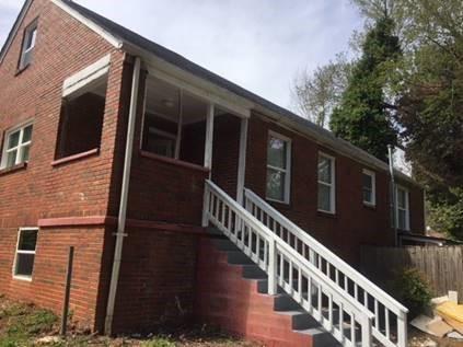 view of property exterior featuring a sunroom