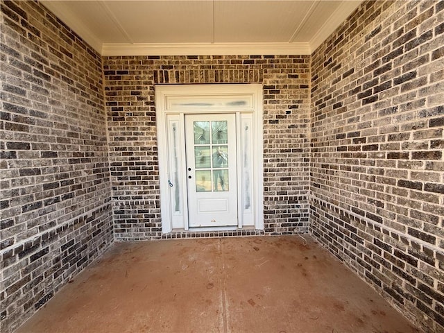 property entrance with a patio