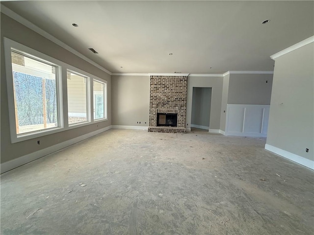 unfurnished living room featuring baseboards, a brick fireplace, visible vents, and crown molding