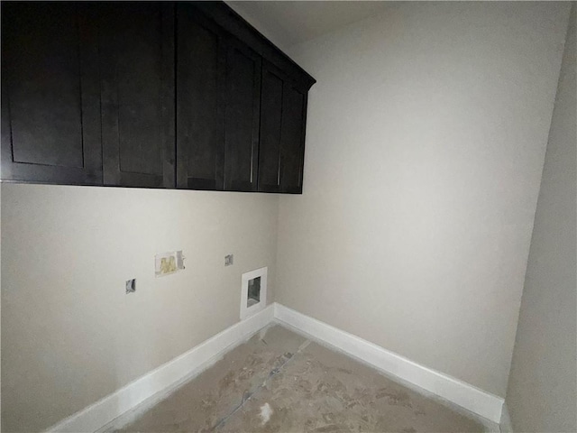 washroom featuring washer hookup, cabinet space, electric dryer hookup, and baseboards