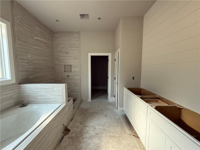 full bathroom with a bath and tiled shower