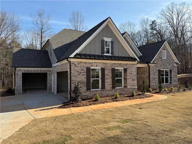 craftsman house with driveway, an attached garage, a standing seam roof, board and batten siding, and brick siding