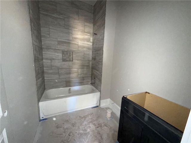 bathroom featuring washtub / shower combination and baseboards