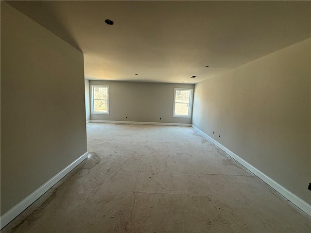 empty room featuring baseboards