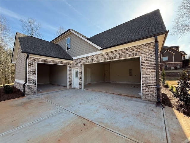 exterior space with concrete driveway