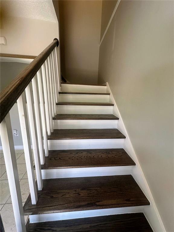 4701 Flat Shoals Rd, Union City, GA 30291 - stairway featuring tile patterned floors