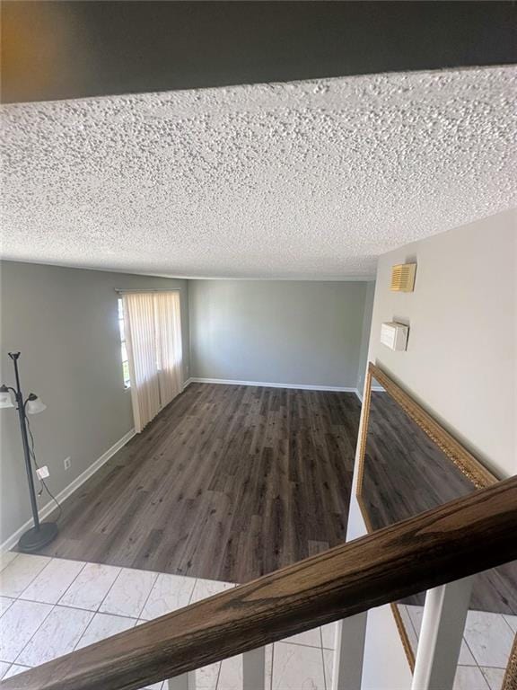 4701 Flat Shoals Rd, Union City, GA 30291 - unfurnished living room featuring tile patterned floors and a textured ceiling